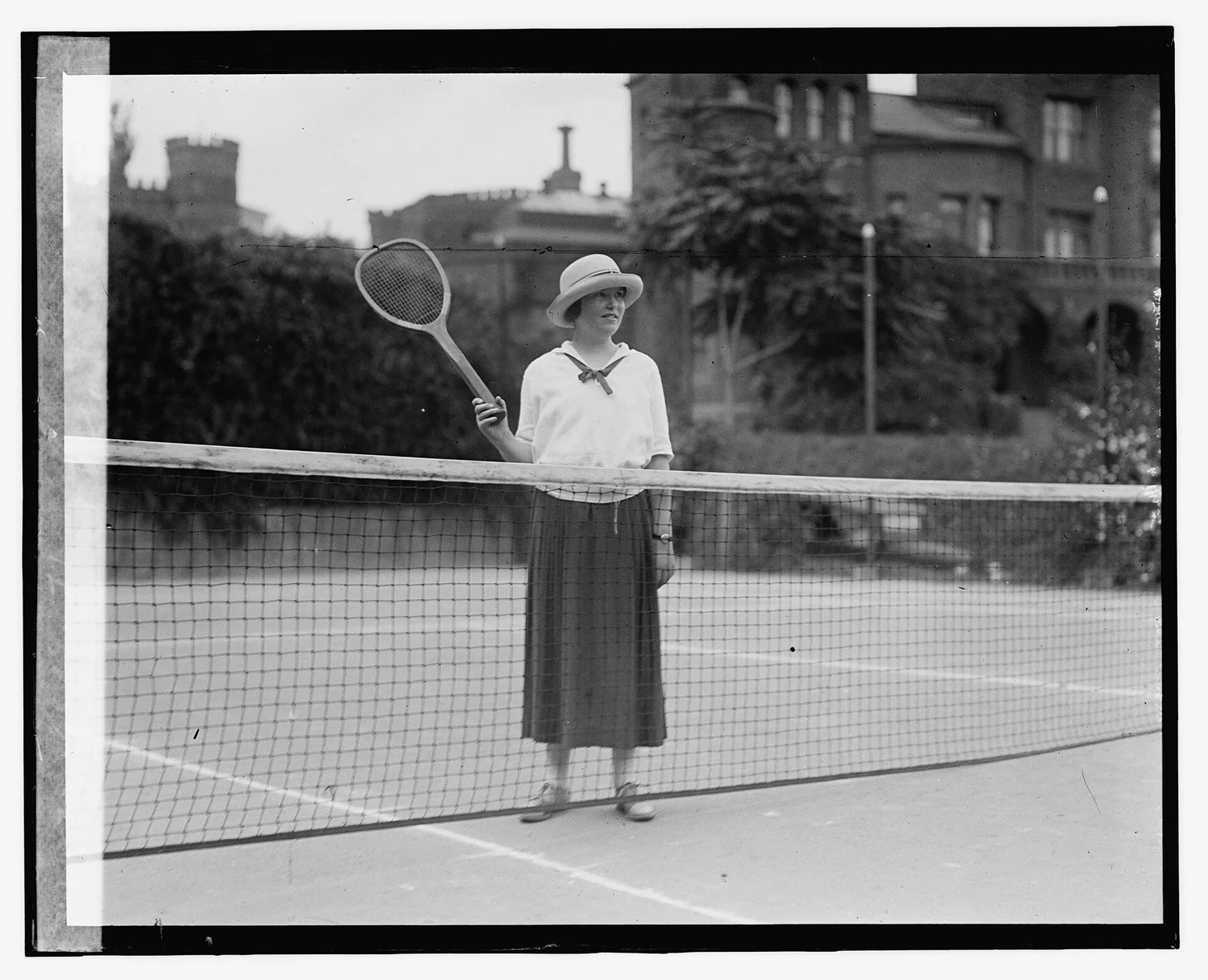 Elizabeth Hughes on a tennis court, about 1924