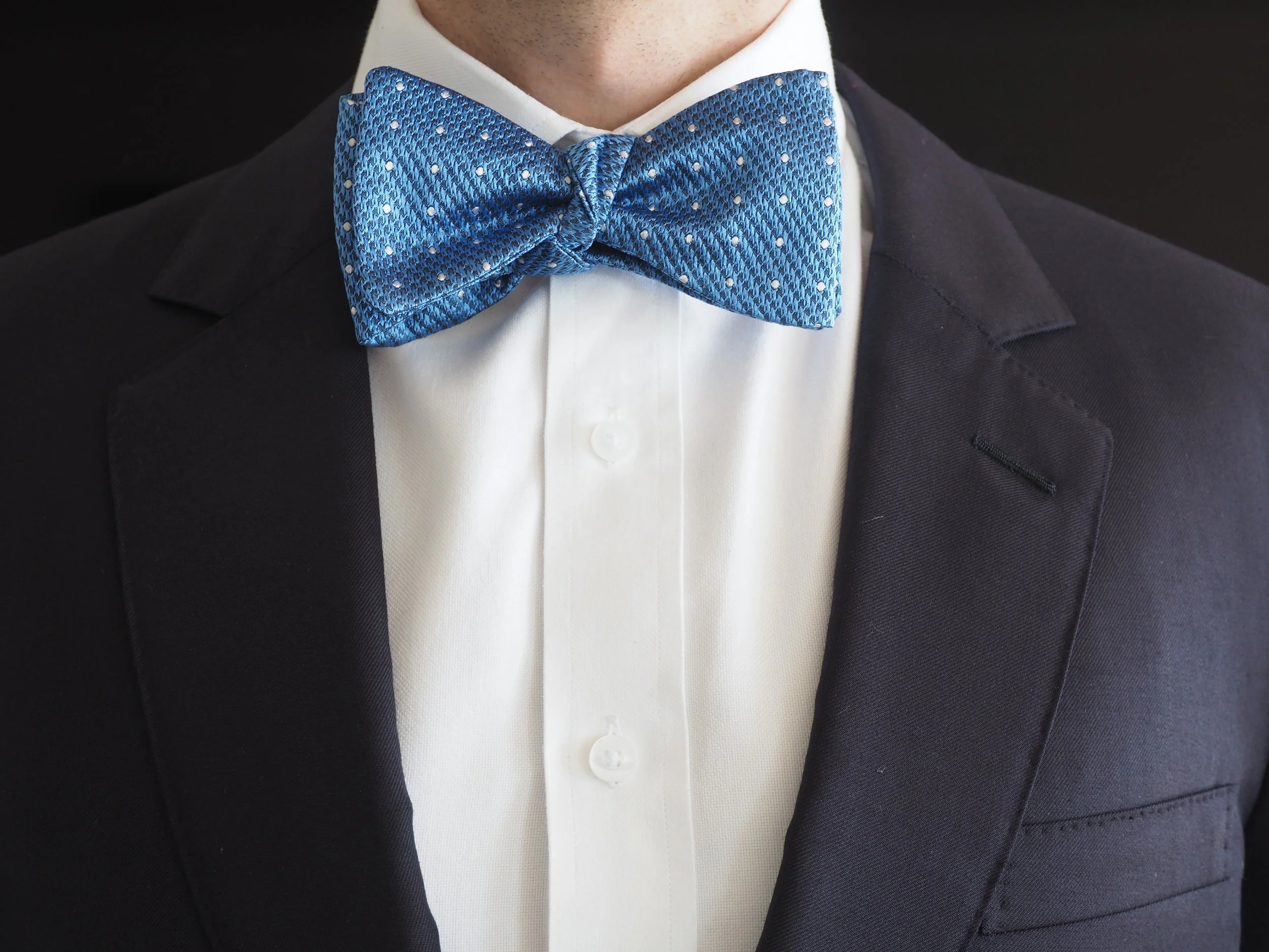 blue and white poka dot silk bow tie