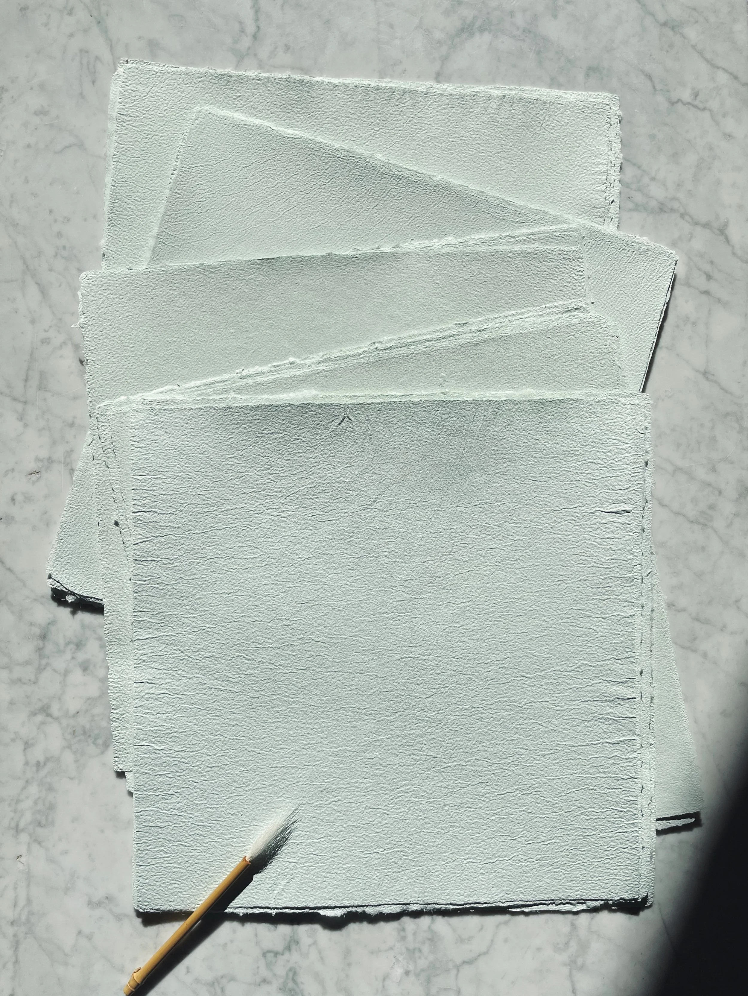 recycled-cream-green-paper.jpg
