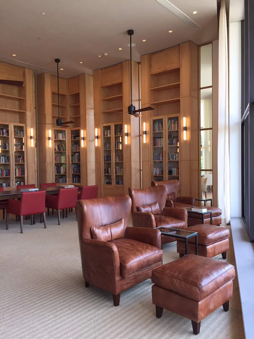 Plush and home-like library space with wall to wall stacking