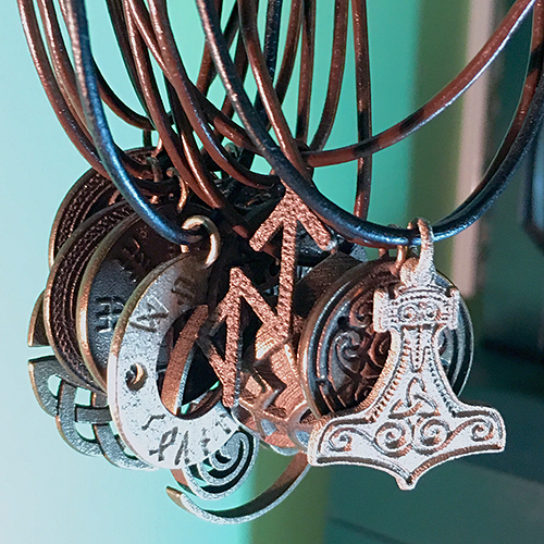A line of jewelry for him or her, made of stainless steel and bronze and gold finishes, featuring traditional symbols from ancient cultures.