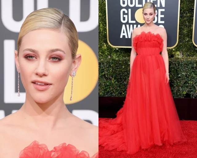 Lily Reinhart in een jurk van Khyeli Couture. Haar haren classy en strak naar achteren gedragen.