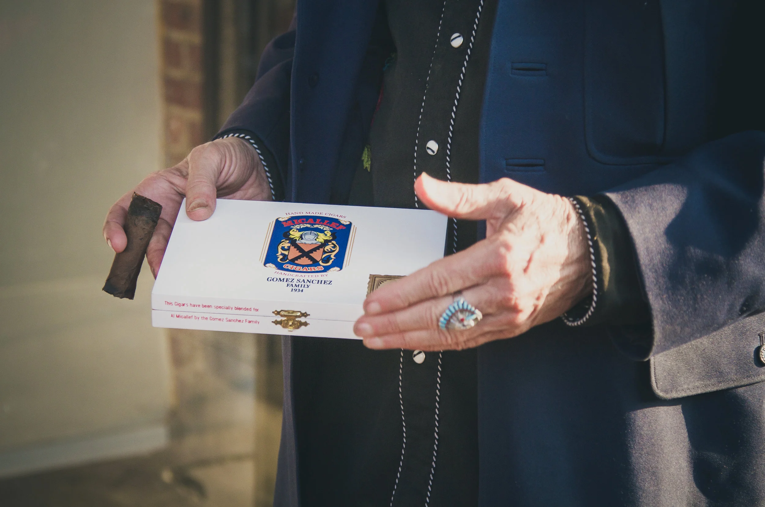 Kinky Friedman and a box of Micallef Reserva Limitada Pravada in Fort Worth, TX