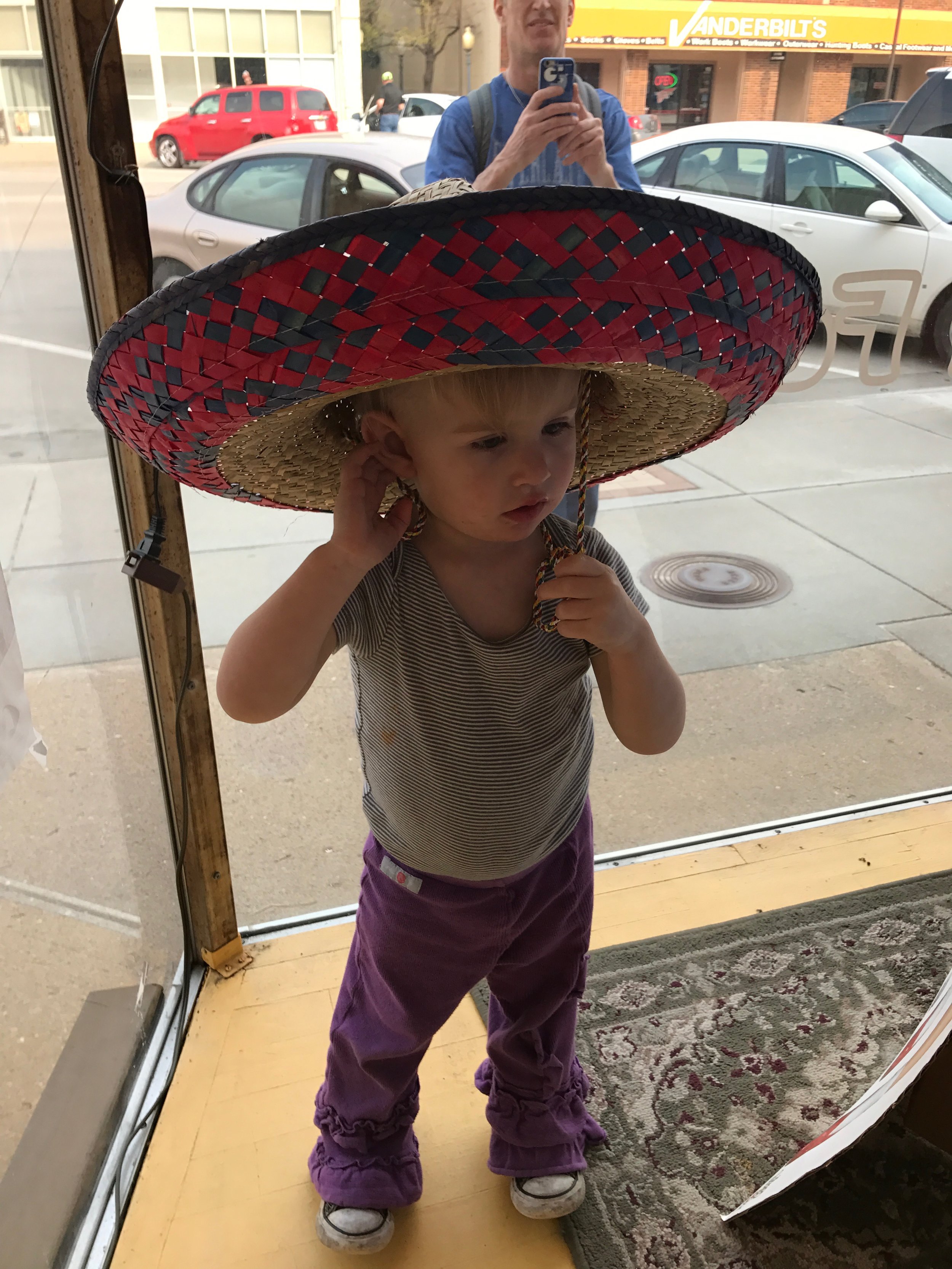  As I said, she loves to climb. And try on hats in windows.  