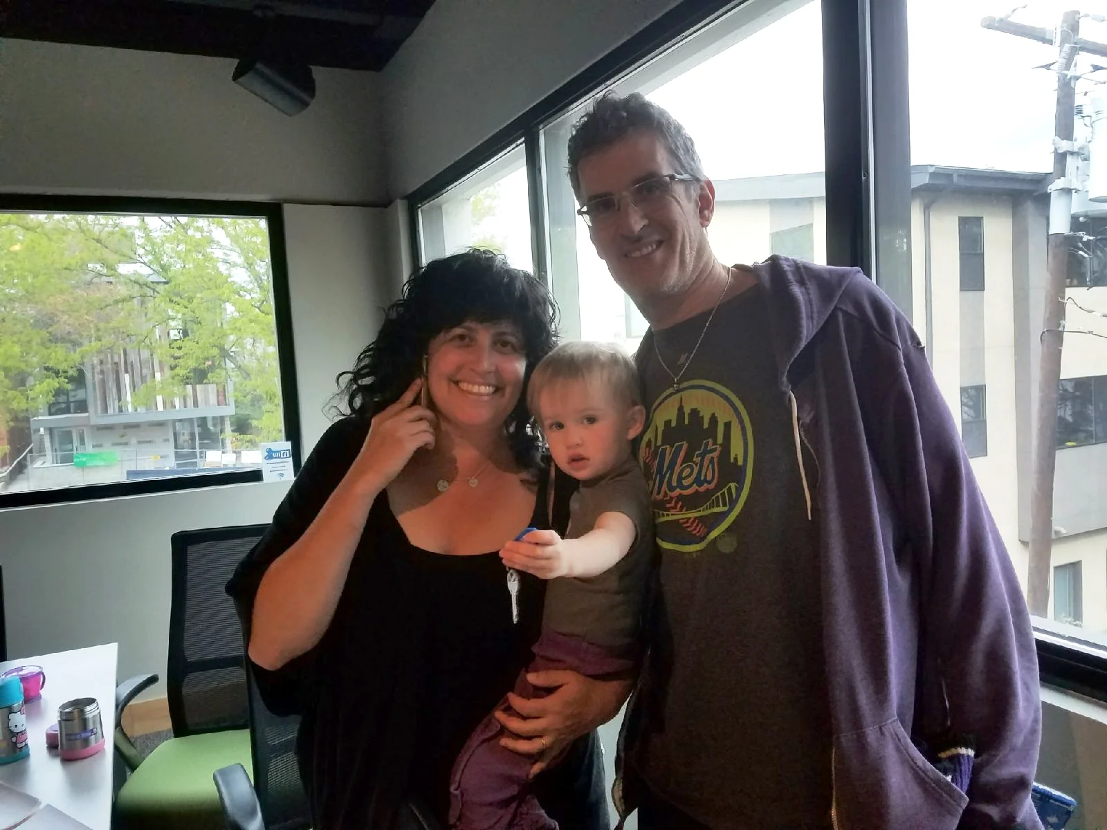 At the Denver house closing with Isa appropriately holding the keys to our new life. Photo credit: the amazing Cindy Ferrara, realtor extraordinaire.