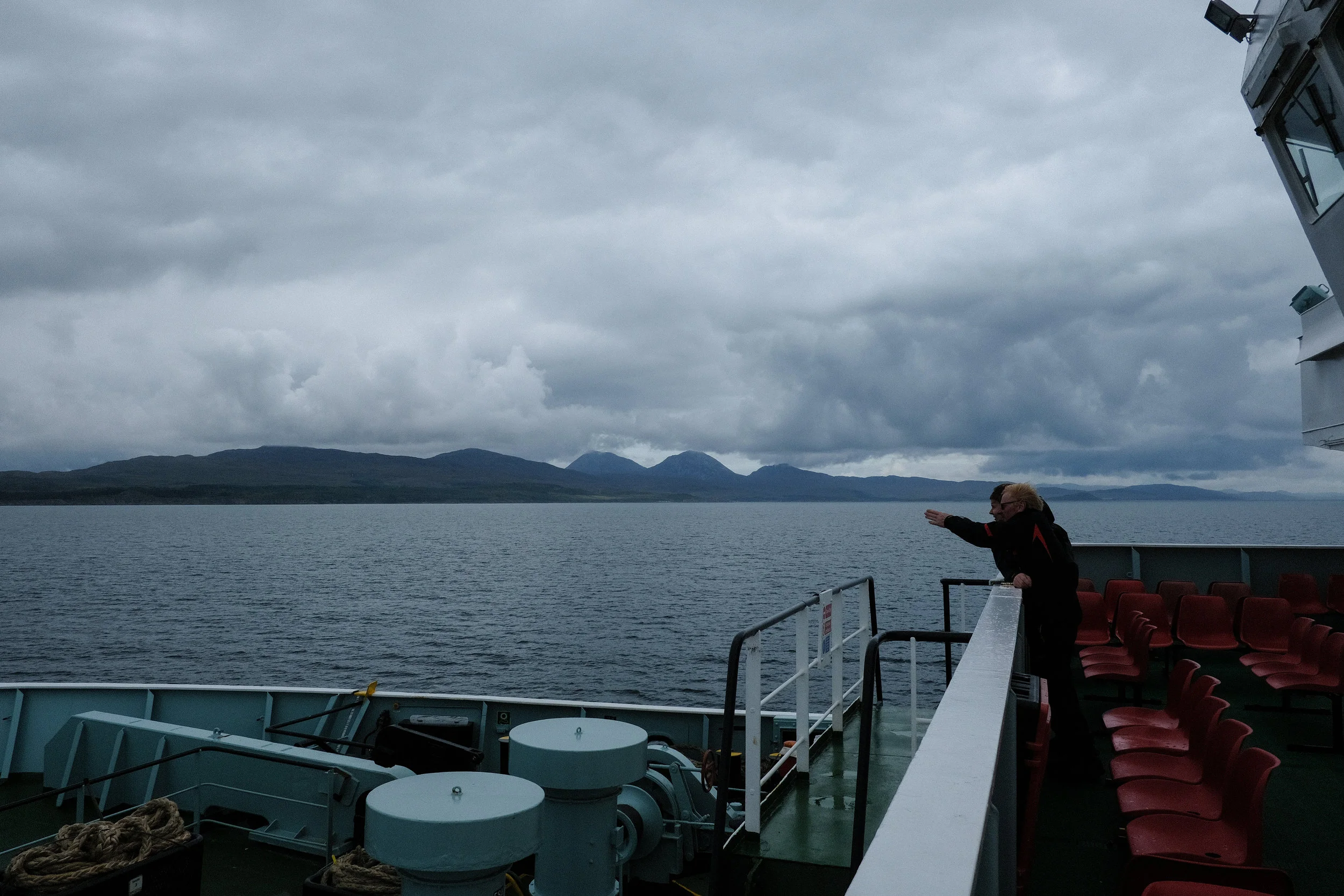Passengers on the Caledonian MacBrayne ferry to Port Askaig, with the Isle of Jura in the background. © Adam McCauley | 2017