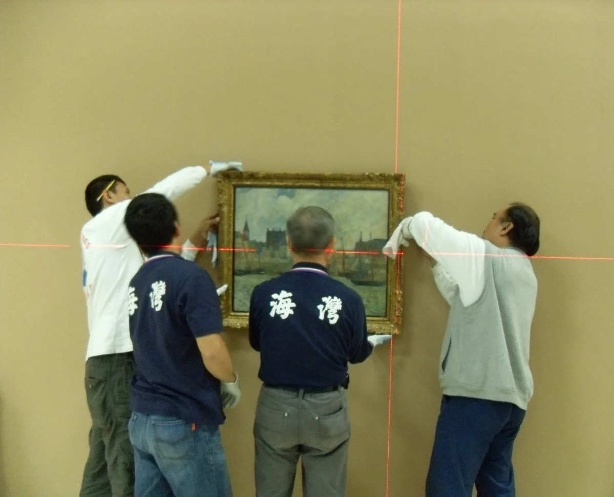 Harbour Scene, Dieppe by Paul Gauguin (1944.46) being hung by technicians at the Taipei Fine Arts Museum in 2011