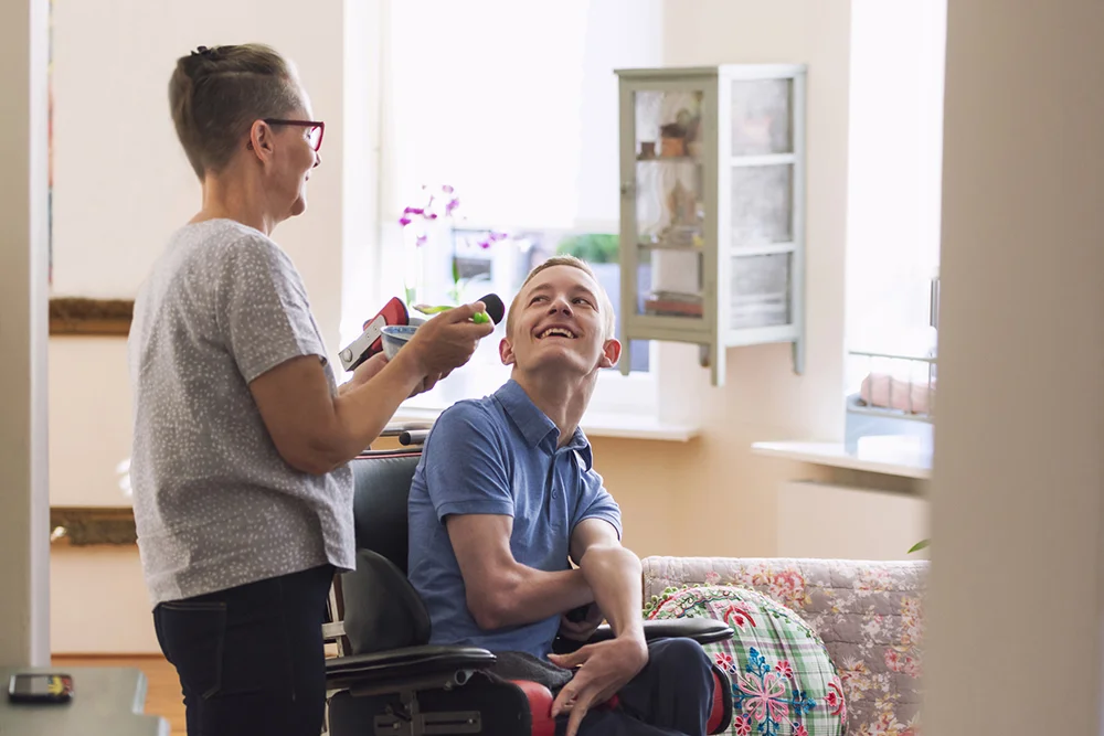 Eskleigh_man in wheelchair with nurse.jpg