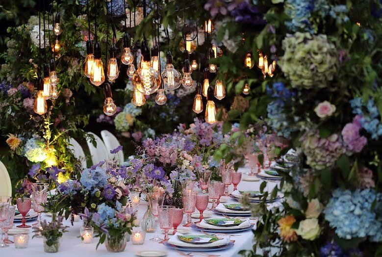 Part 2!
The 3 ceremony arches were reused to create a tunnel of flowers, encasing the table and guests in scented flowers and magical seasonal foliage. This is a great way of reusing you ceremony flowers and adding drama to the reception! Wild arrang