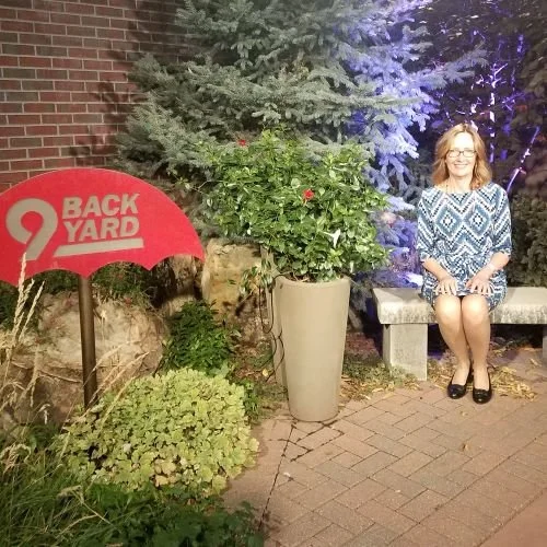 Tam John, founder of Daisy Fields Company, in the 9News backyard in Denver, CO.