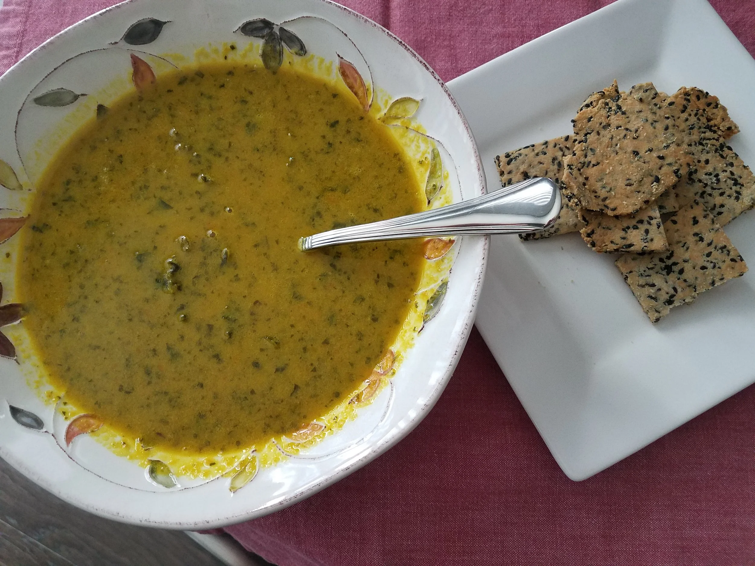 Creamy Carrot & Kale Soup with protein rich sesame crackers by Tam John