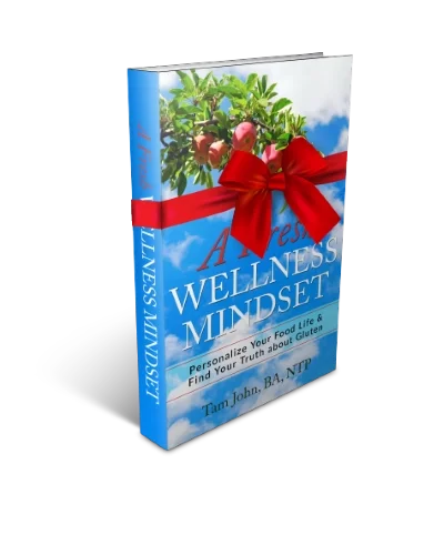 The book cover for "A Fresh Wellness Mindset:  Personalize Your Food Life and Find Your Truth about Gluten" with a red bow to symbolize a loving gift.
