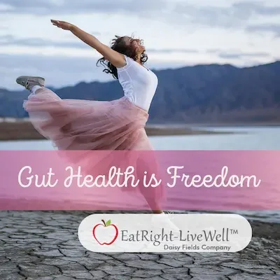 Woman leaping for joy on the beach with the symbolic text 'Gut Health is Freedom' for virtual nutritional therapy and microbiome botanicals.