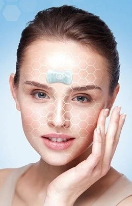 Close-up of a woman's face wearing the SF3™ Microcurrent Facial Mask with hexagonal grid overlay, illustrating targeted bioelectric skin therapy.