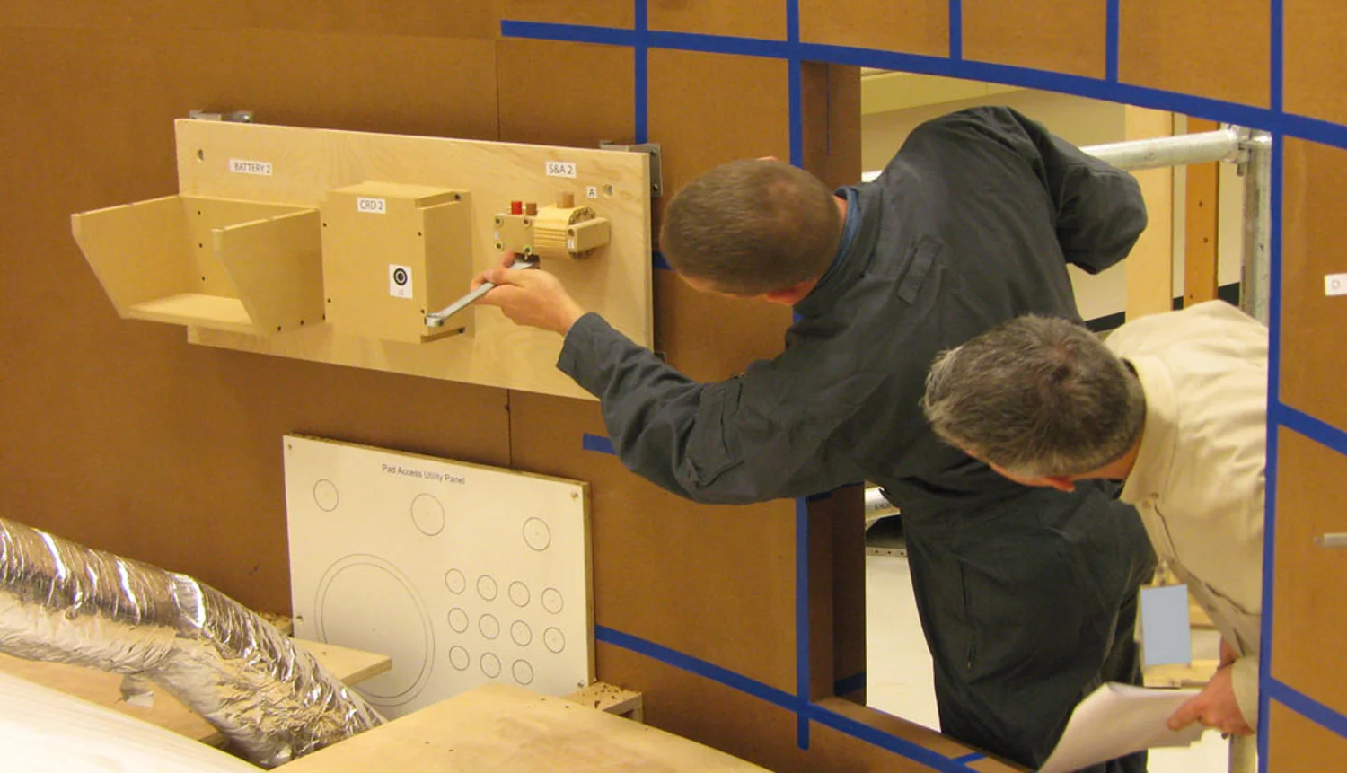 Simulating reach-in tasks to assess visibility and tool clearance.