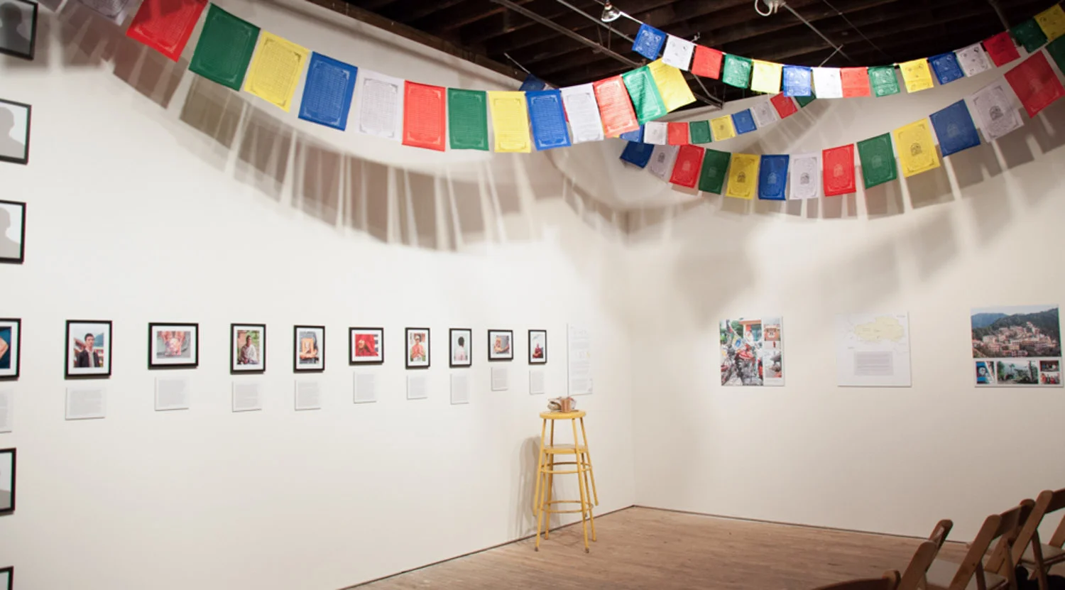 Installation included portraits, bios, silhouettes, narrative sketches, map of Tibet, photos of Dharamsala and traditional Tibetan Buddhist prayer flags.