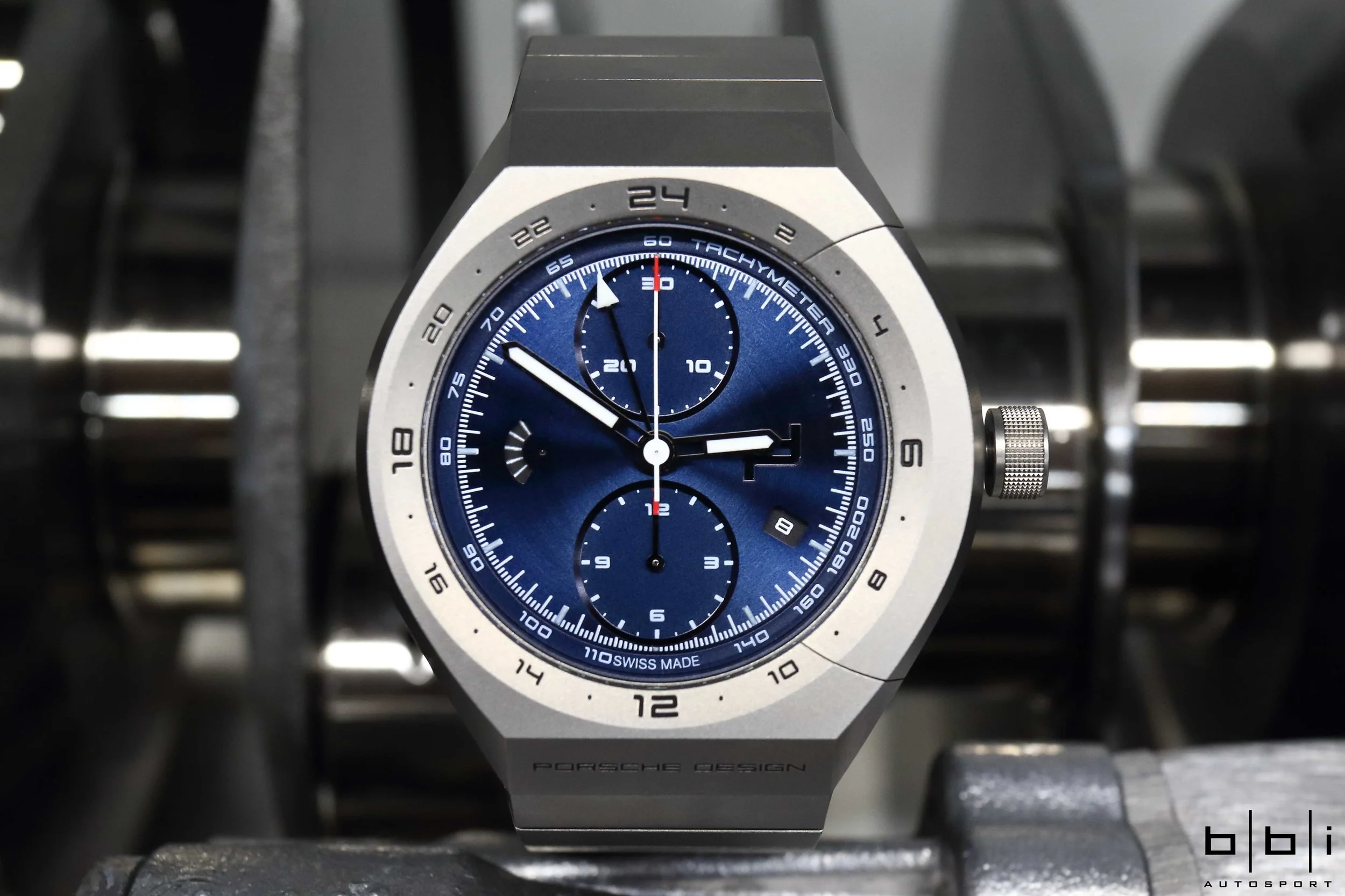 We got to spend some time with the Porsche Design's new Monobloc Actuator GMT-Chronotimer All Titanium timepiece here at BBi Autosport. Sharing the same strive for accuracy and precision, here we have it sitting on a Porsche 4.0 liter engine rotating assembly balanced to +/- 2/10ths of a gram that will be spinning at over 9k rpms in the near future. Drawing inspiration from racing car engines, the chronograph utilizes a single rocker switch, which is integrated directly into the case, in place of the familiar push-piece. For more information, please visit: http://www.porsche-design.us/timepieces/monobloc-actuator/ 