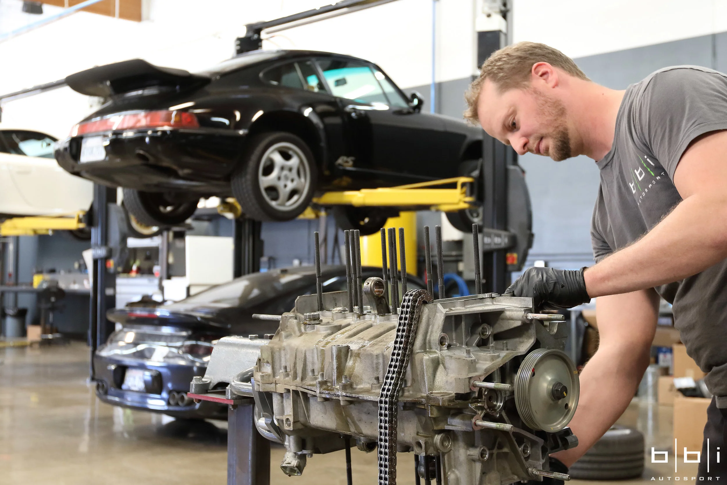 Disassembling the engine to clean and inspect components.
