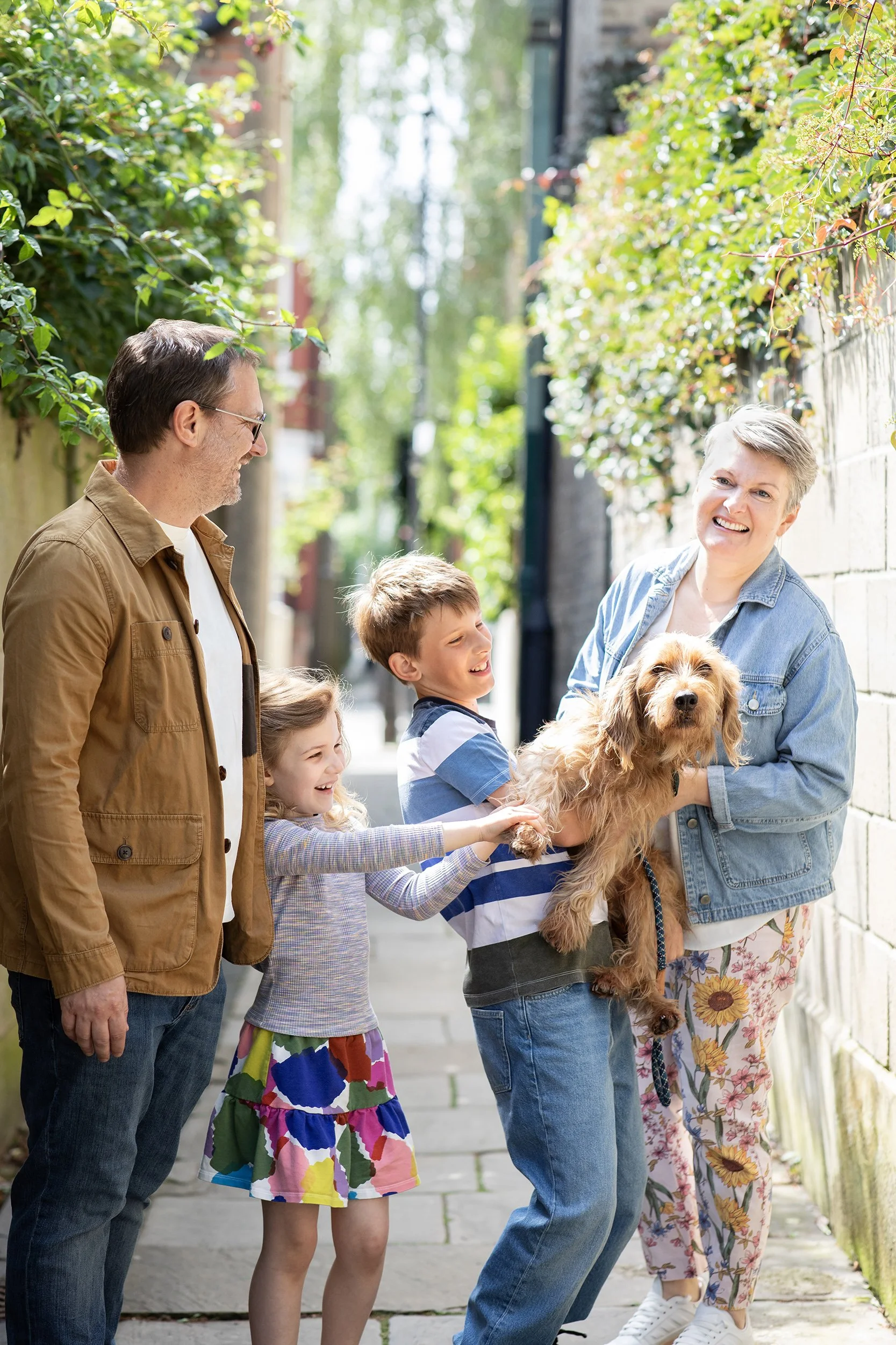 a family of four with their dog