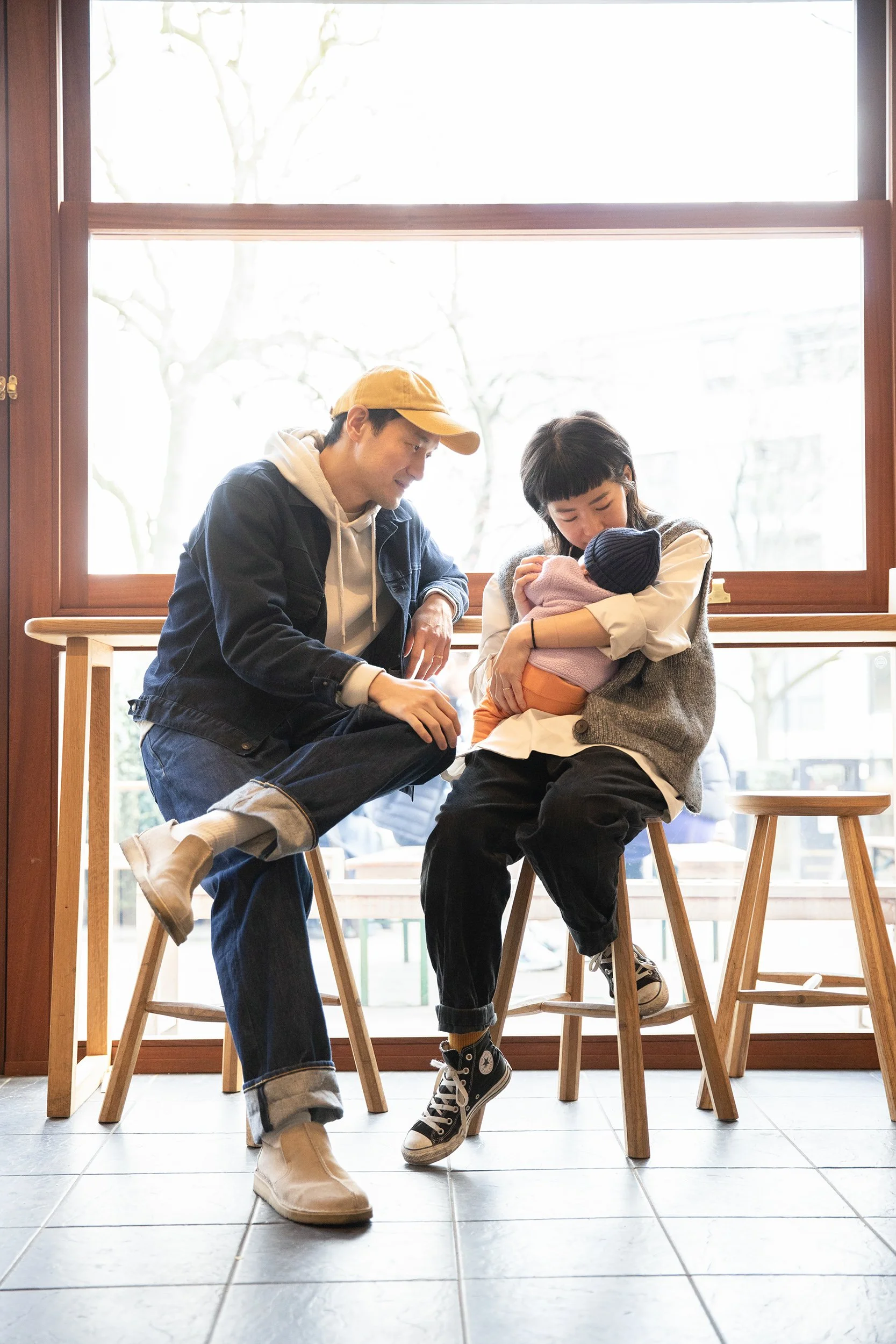 a couple with their newborn in a lifestyle store