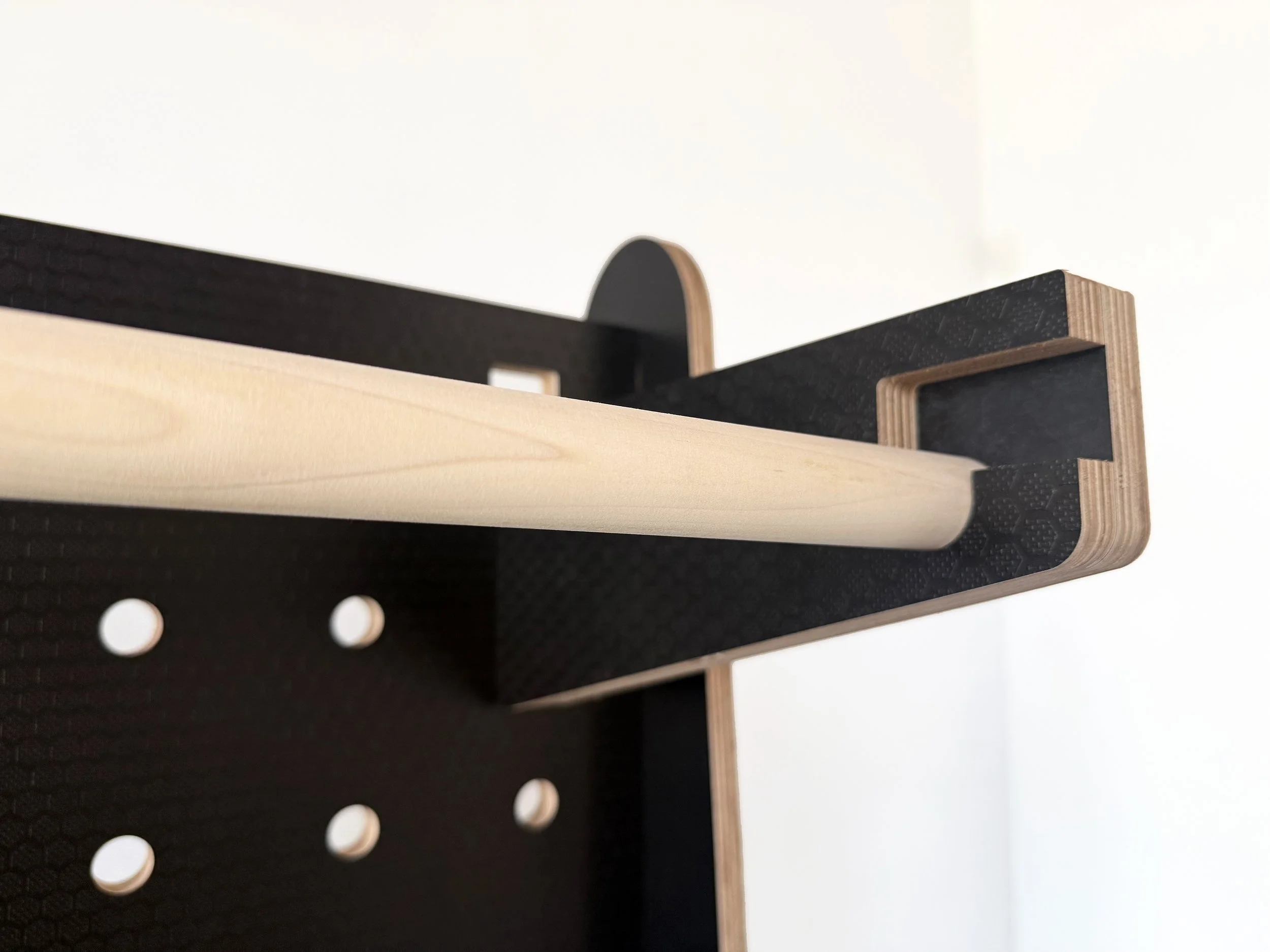 black-pegboard-with-clothes-rack-display