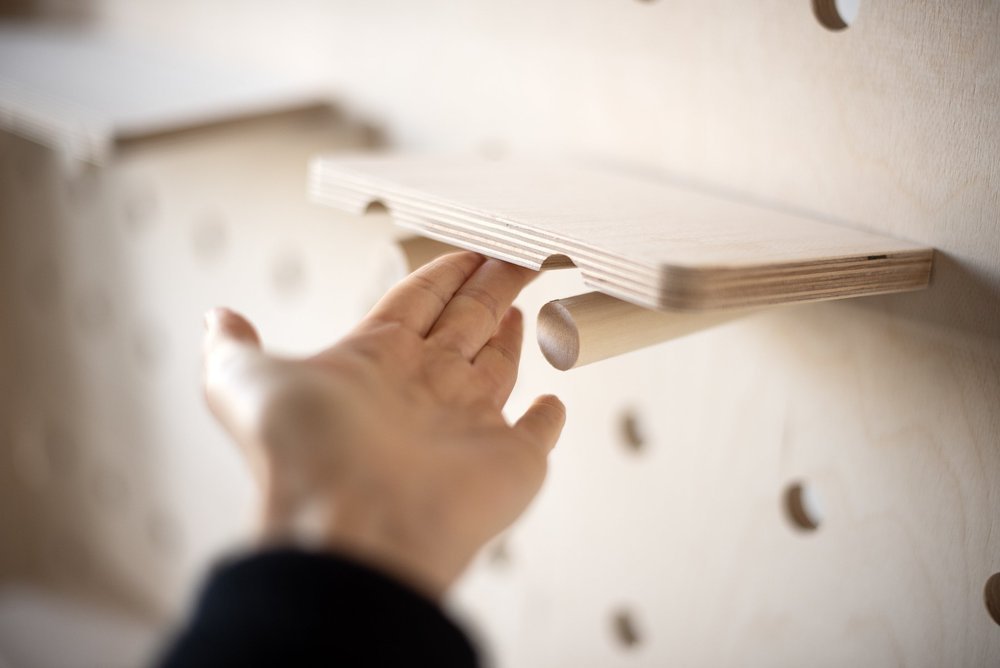 Wood-pegboard-with-pegs-and-shelving-canada