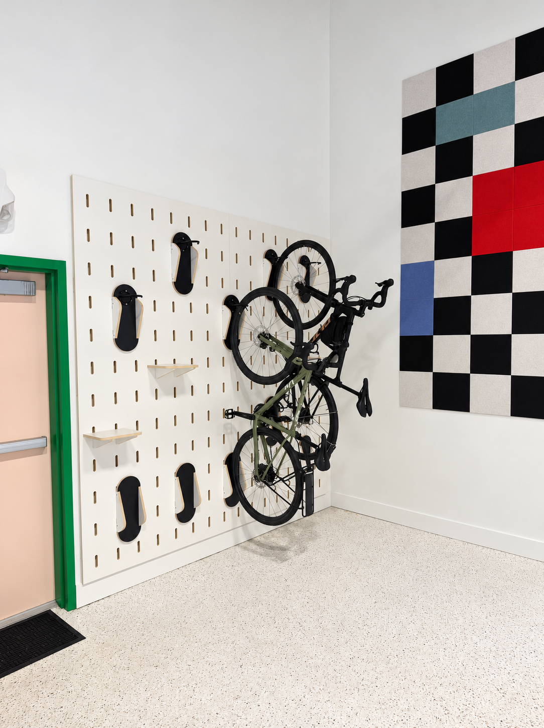 Custom modular slot pegboard bike storage wall by Klo Lab for Black & White Zebra