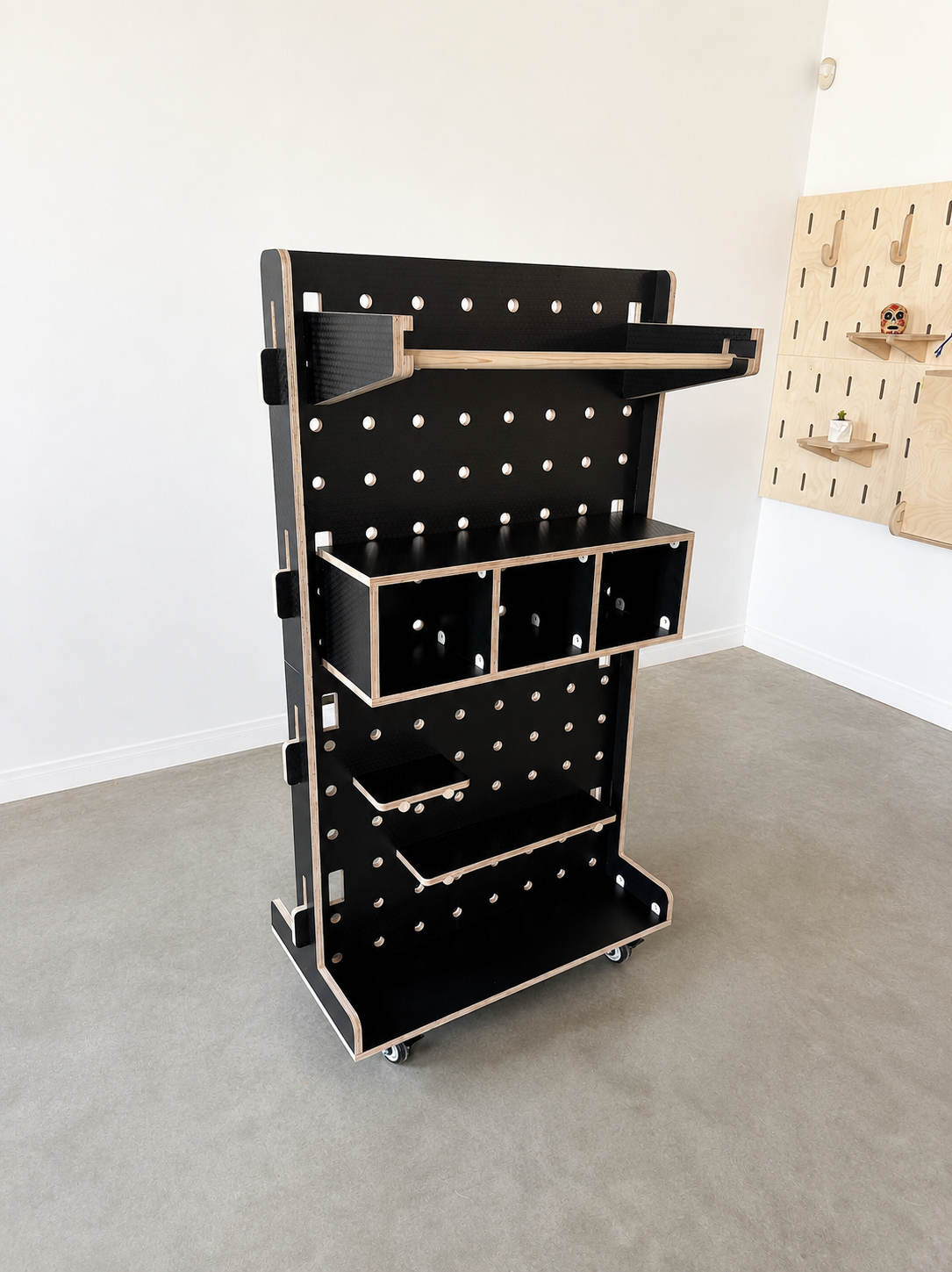 Black Hexa plywood rolling pegboard display for retail and pop-up shop