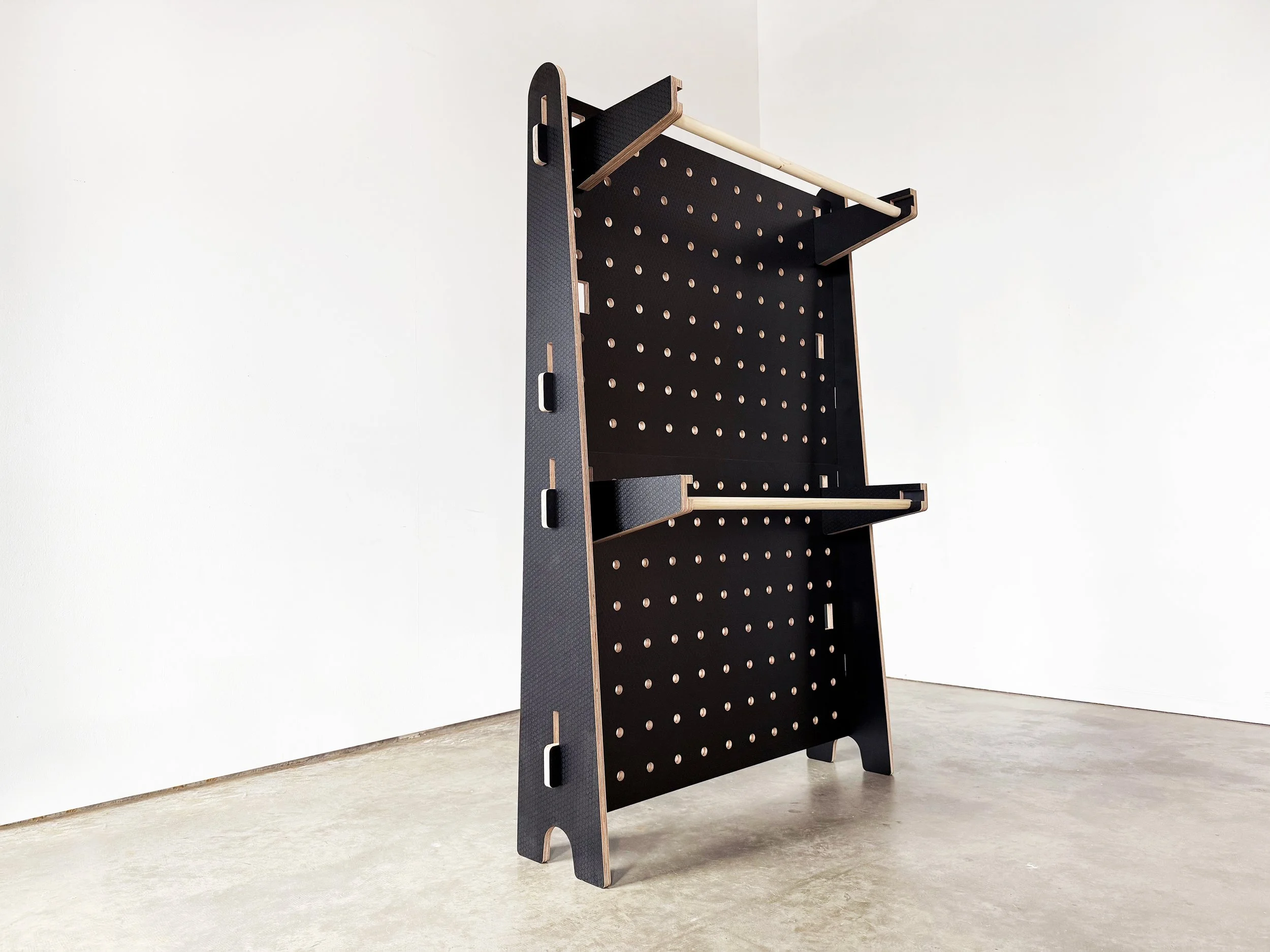 Freestanding pegboard display made with Hexa Ply, front view.