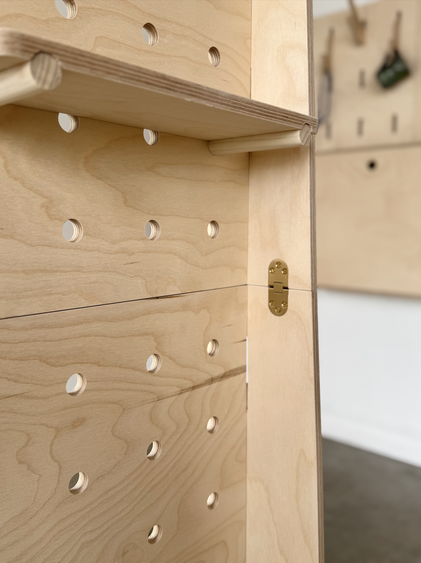 Large flatpack freestanding mobile wood pegboard display