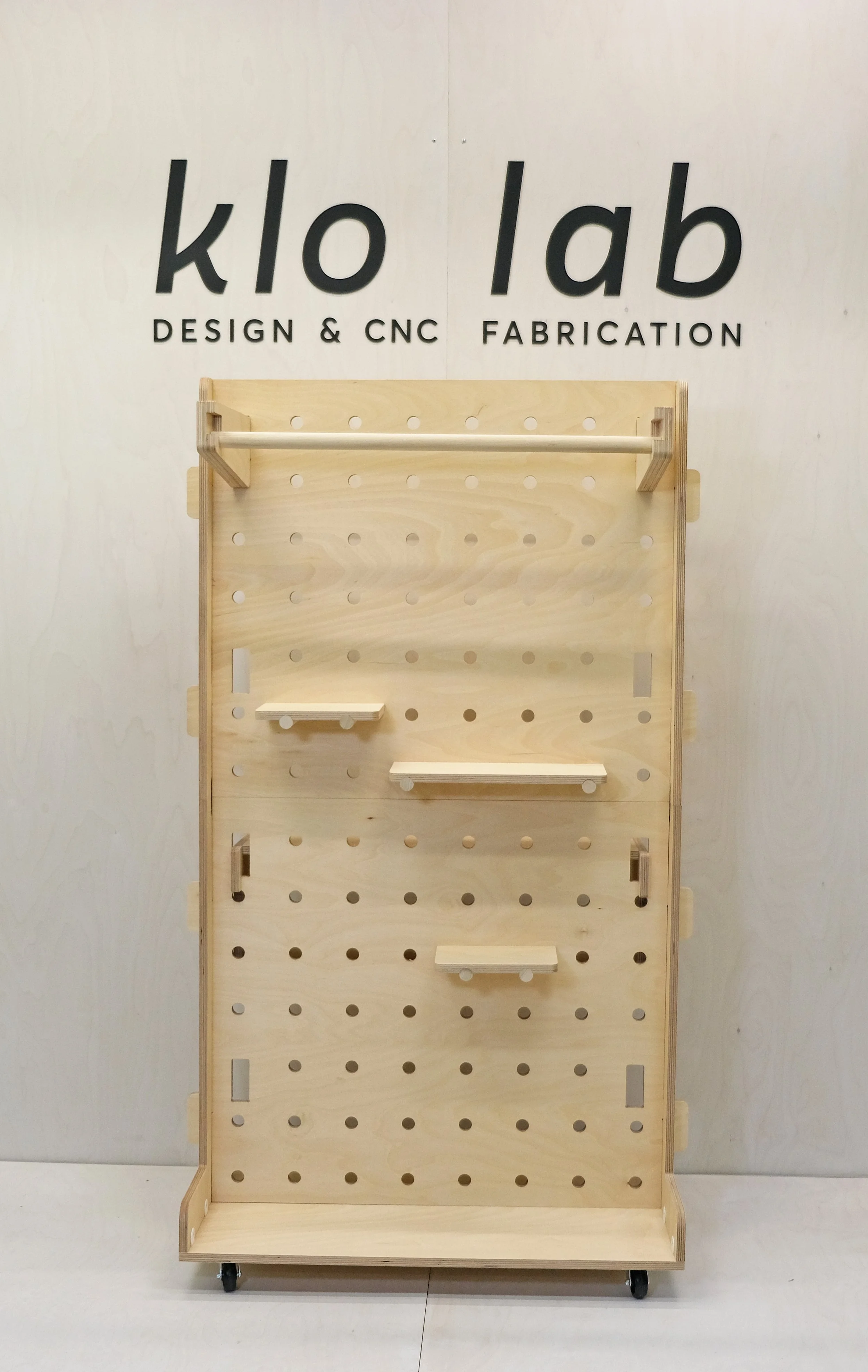 Mobile pegboard retail display with foldable legs and modular accessories