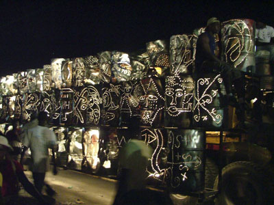 from their page: the Atis Rezistance 2006 Mardi Gras float made from over a hundred metal oil drums lit from within, beautiful masks and Vodou veves