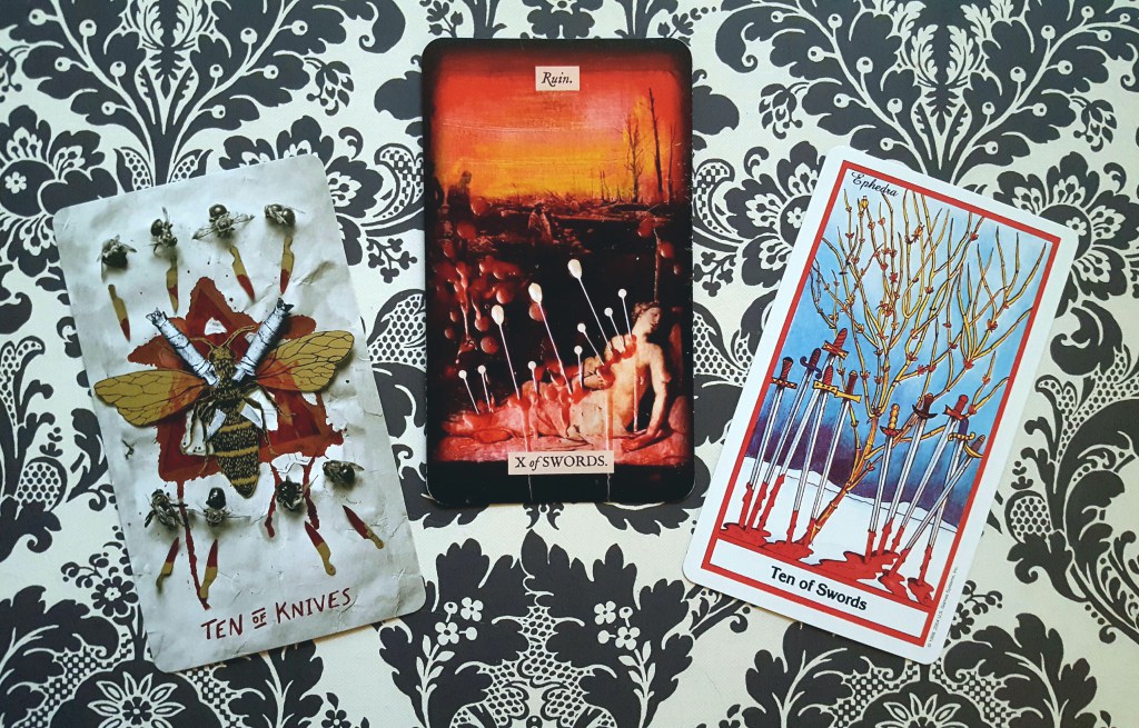 Ten of Swords (Slow Holler, Stretch, Herbal tarot decks)