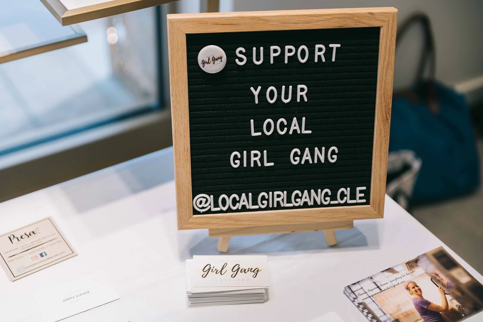 The community table is always full of business cards from entrepreneurs and business owners at the event. Photo by Anita Louise Photography