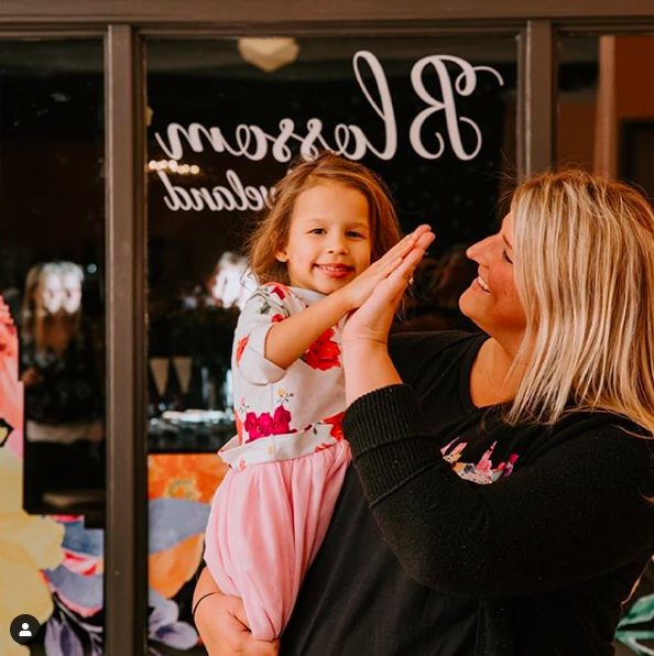 Megan Robinson with her daughter, Blossom, who inspired her store!