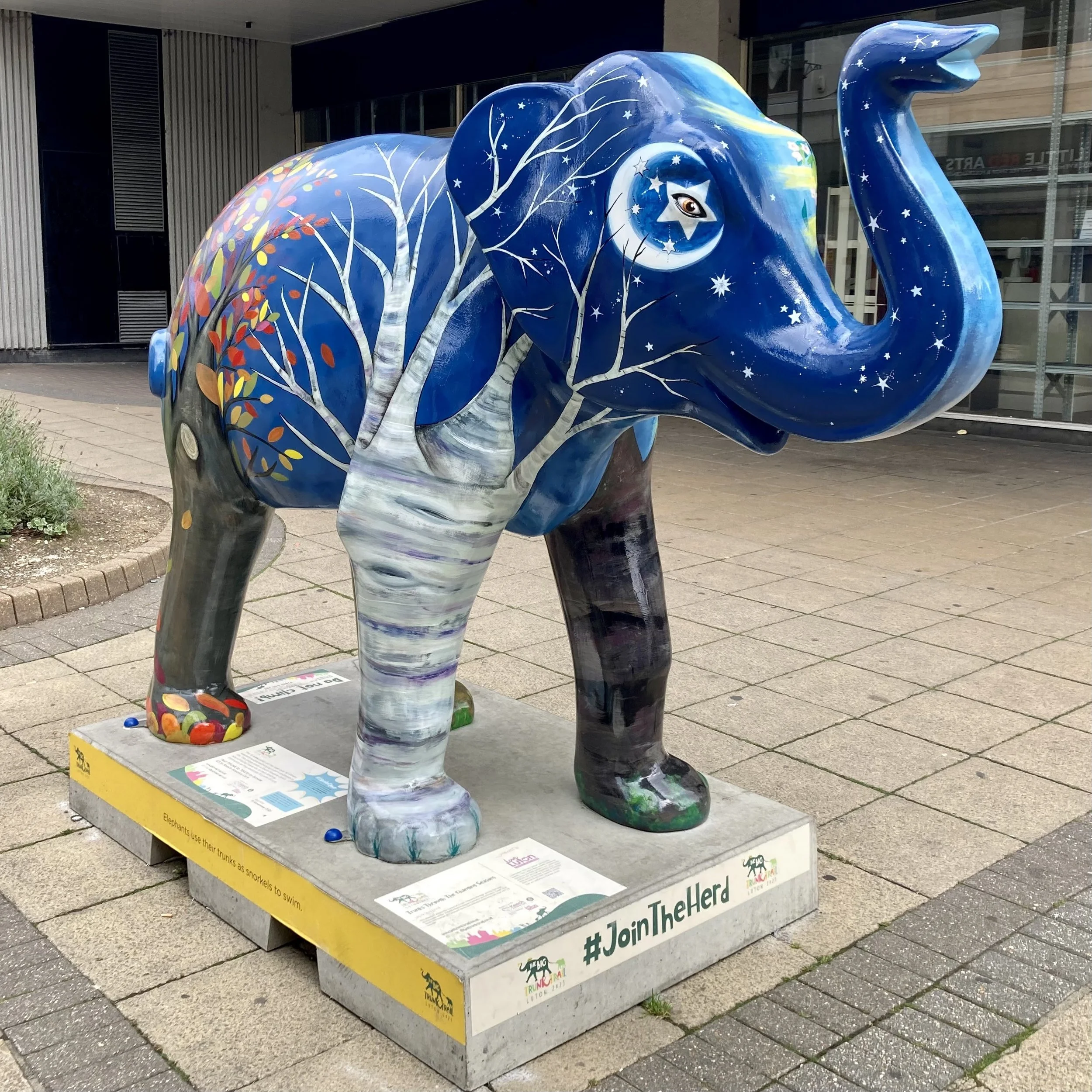  Public Art Sculpture ‘Trunks Through Changing Seasons’, painted for  The Big Trunk Trail , Luton 2021. Commissioned by  Keech Hospice , sponsored by  Love Luton , in collaboration with creative producer  Wild in Art . Masonry paint kindly donated by