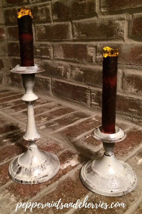 Over the last few years primitive and farmhouse styles have replaced many of the traditional styles. I recently distressed my bronze candlesticks to make them primitive - farmhouse style as part of a DIY Upcycle Challenge. #homedecordiy#farmhousedecor #farmhousestyle#farmhouseideas #diycandleholders#diyhomedecor #candlesticks#candleholders #upcycle