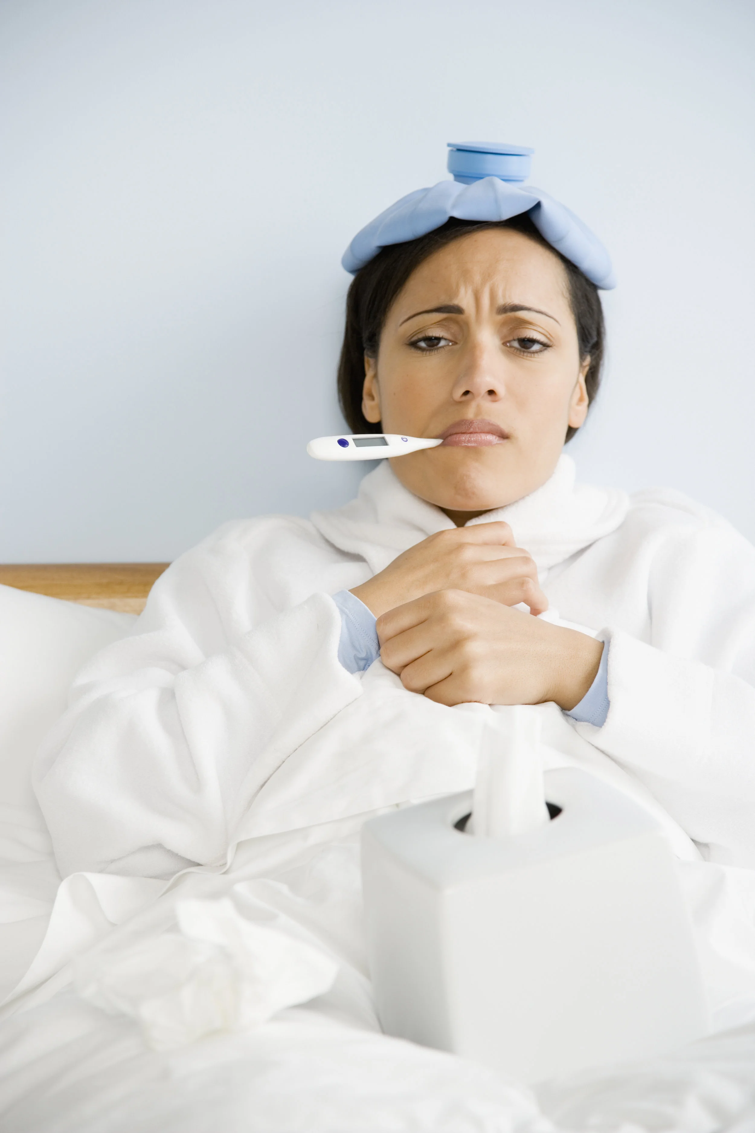 GettyImages-78567833 sick woman hot water bottle.jpg