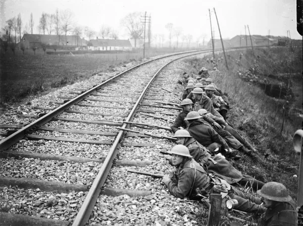 British troops forming a line of defence beside a Merville railway track, 11 April 1918.