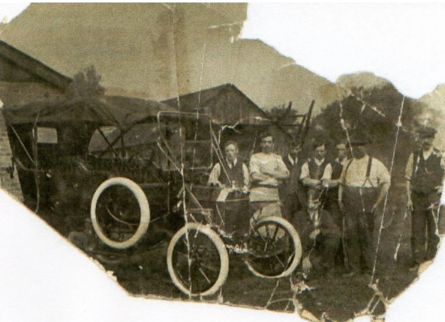 Frederick Plant (kneeling} with other employees at the coach painting business in Derbyshire