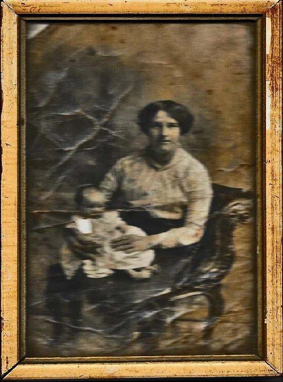 Photograph of George Henry Watts’ wife Mary Ellen Watts with their nine month old daughter Mary Ellen. The photograph was found on the battlefield and returned to the family.