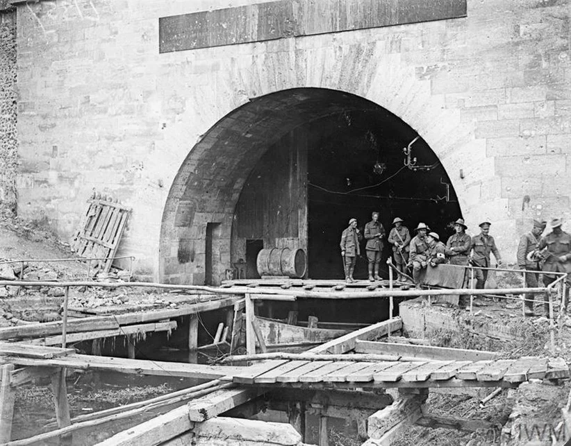 Photograph showing soldiers of the 30th American Infantry Division and 15th Australian Brigade (5th Australian Division) at the southern entrance at Riqueval of the Bellenglise to Bellicourt Tunnel, captured by 1/6th South Staffords on 29th September 1918.