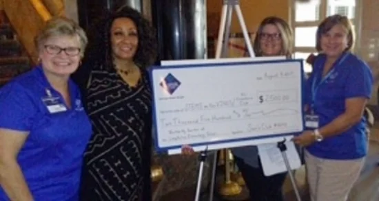 Sam's Club store manager Toni Gicinto (on the right) and her staff present a grant award check to Imani Malaika-Mehta, Executive Director of STEMS on the VINES/KC Creators Clubs. These funds will help fund daily program expenses and sponsored our annual field trip to iFly indoor skydiving so students can learn the physics of flight. Thank you, Sam’s Club!