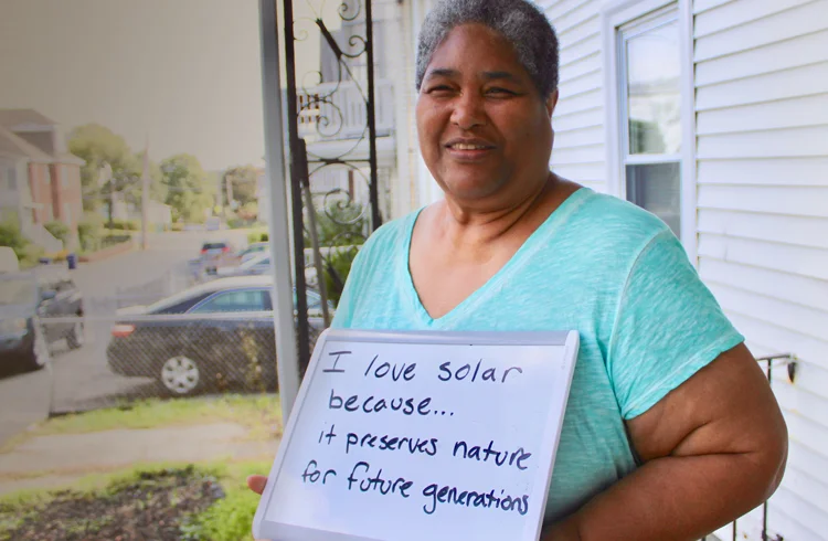 Boston resident and climate leader Olive Knight got solar panels installed on her roof at no cost through the Solar Access Program, financed by Sunwealth in partnership with local developer Resonant Energy. (Photo courtesy of Resonant Energy)
