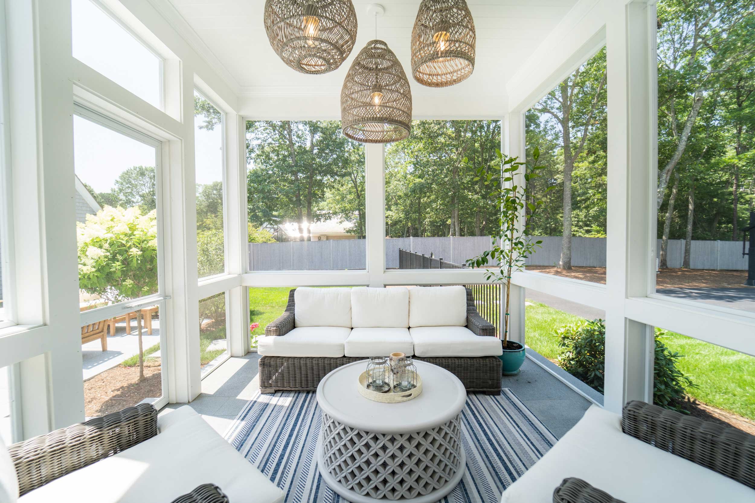 james-golden-oyster-harbors-family-compound-screened-porch-lanterns.jpg