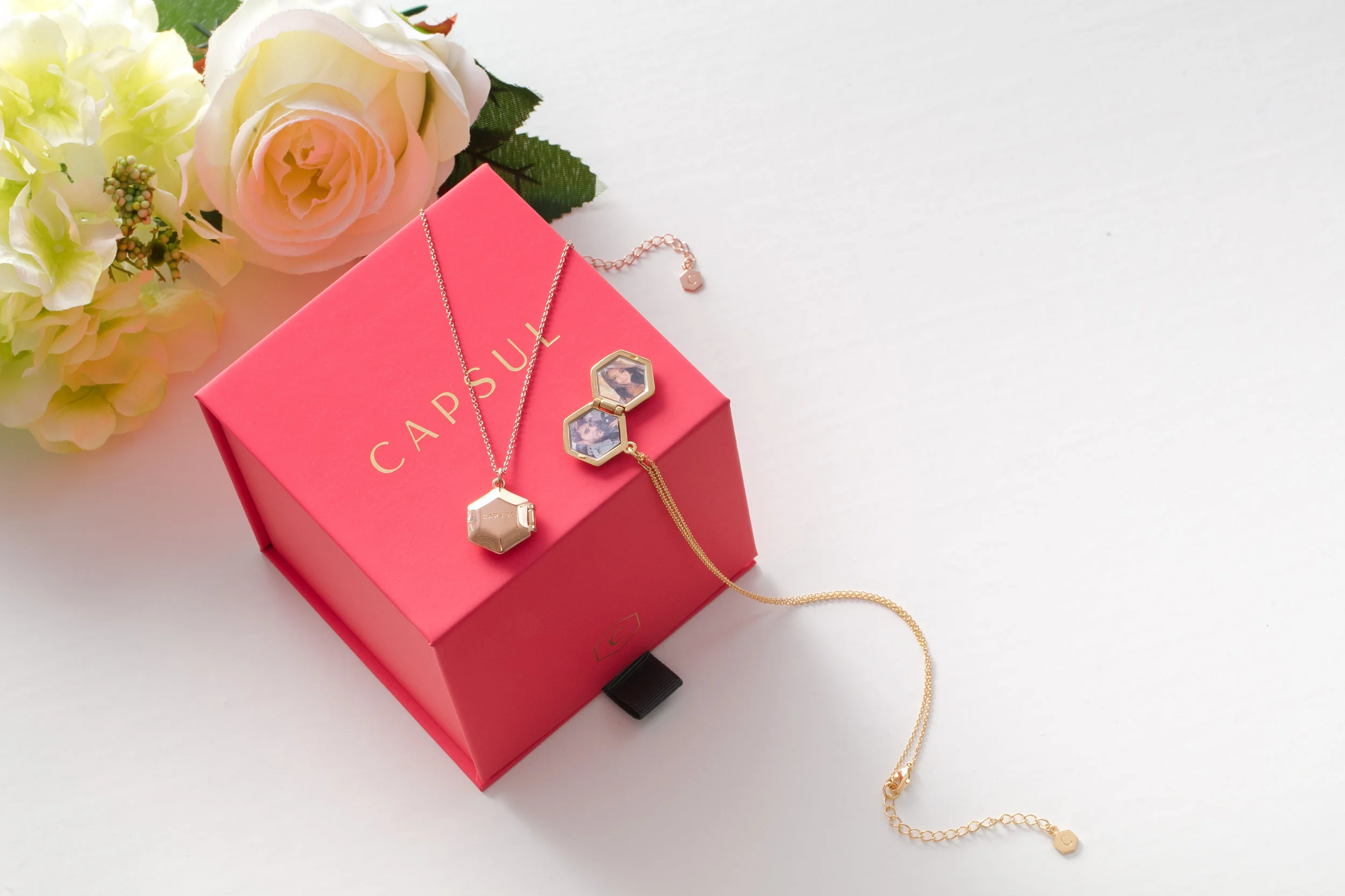 Capsul Locket Necklace: Keep photos of your loved ones close with the vintage locket made modern. We love these for couples who do long distance. They also make a great gift for new moms!