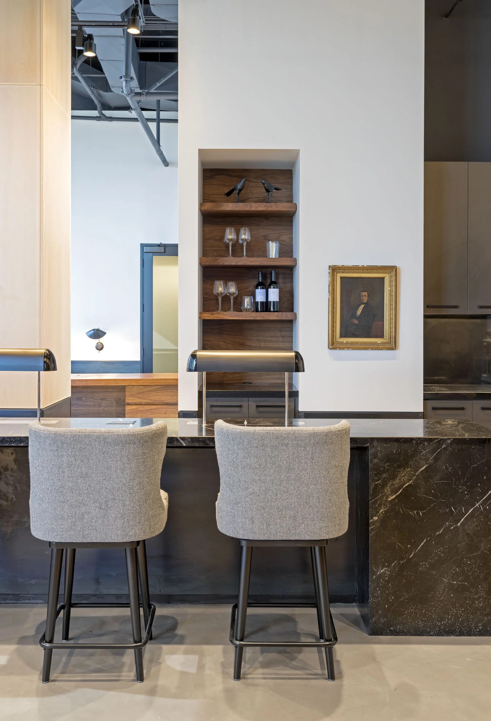 “When designing the office, we constantly had the two founders in mind. They are fast-paced, casual, and well-traveled entrepreneurs who have seen it all, so we needed to impress them while also making them feel comfortable,” says designer Ariel Ashe. “We were working around the existing structures to create an open space and had to enlarge the rooms as much as possible. They wanted their office to look like a high-end club or residence. They didn’t want it to feel like a traditional work space.”