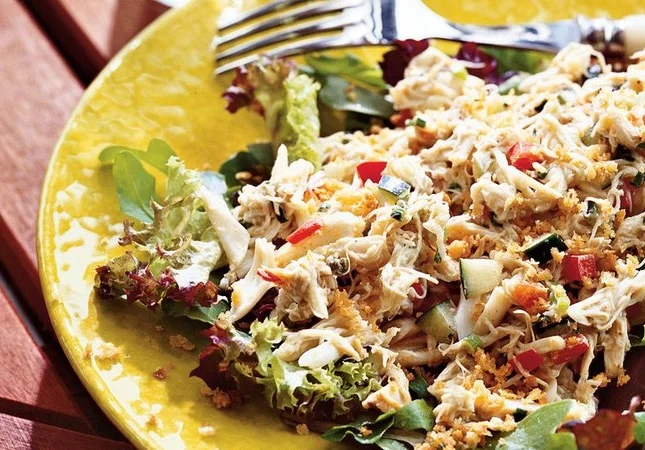 This refreshing crab cake salad is an interesting twist on preparing crab cakes and with the combination of a glass of chilled Vidal Blanc, will leave you longing for the beach.&nbsp;