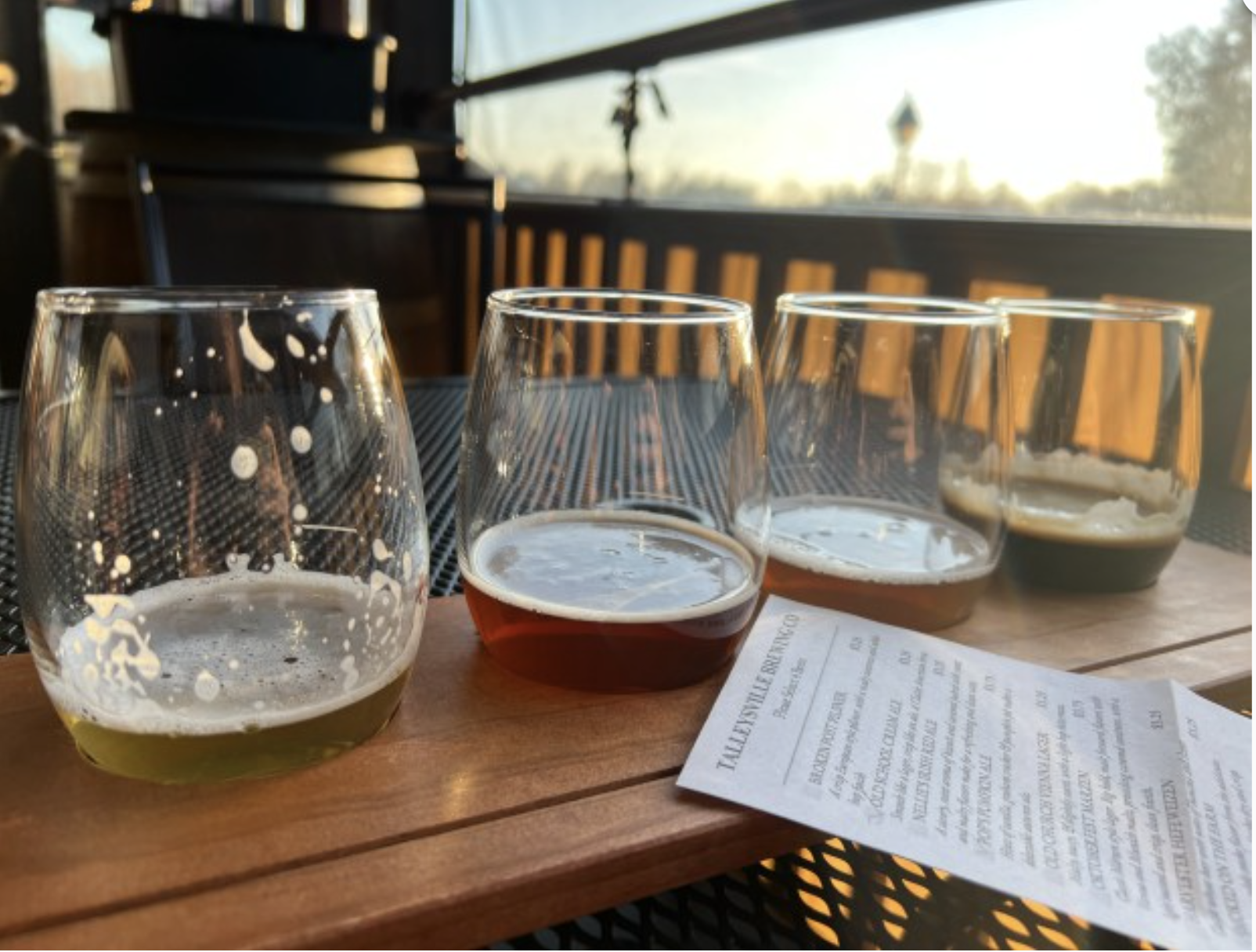 A customer enjoys a flight of beer at Talleysville Brewing Co., located at the New Kent Winery. (Amy McCluskey/For the Tidewater Review)