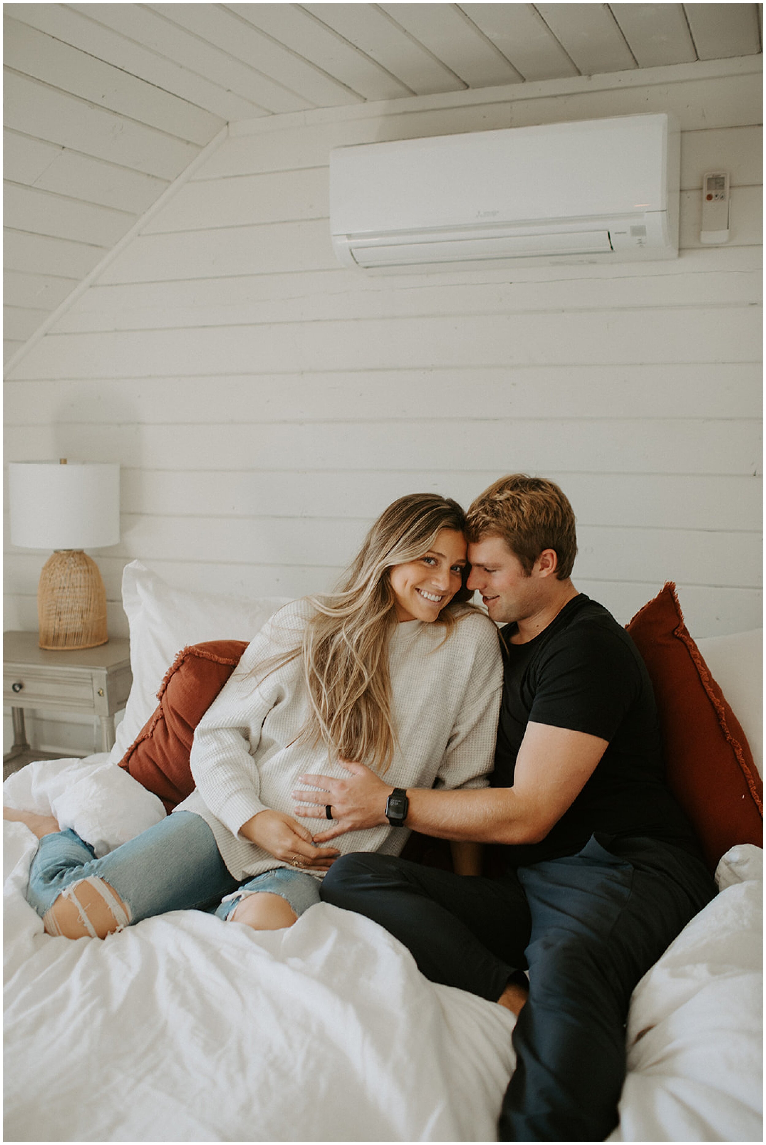 maternity photos on bed